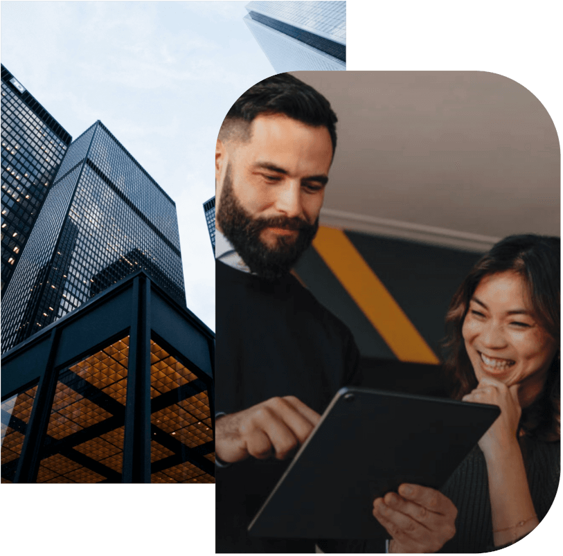 Man smiling at his tablet and the lady looking at the tablet too.